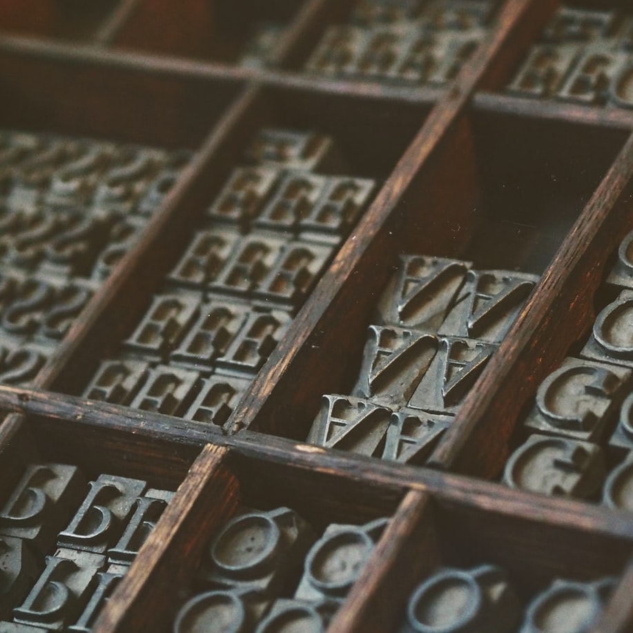 Metal Baskerville Letter Stamps Organised in shelves